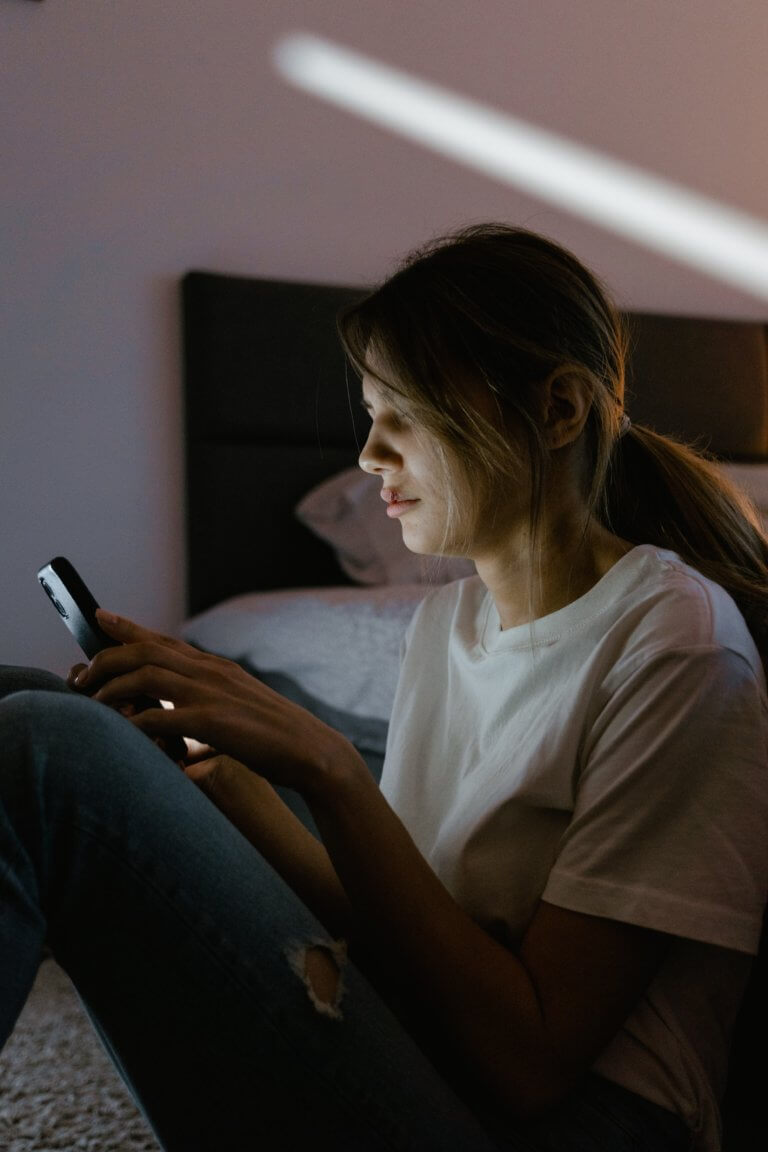 Woman finding Mental Health Help and Resources on her phone.