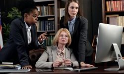 Legal professionals looking at computer monitor
