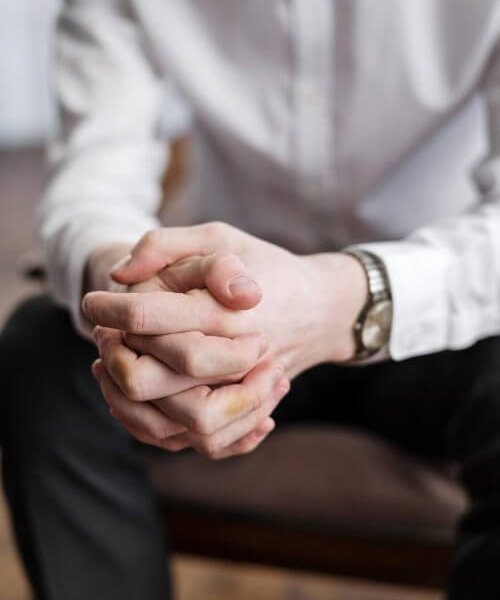 Man clasping hands